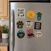 Custom printed logo magnets displayed on a flat indoor magnetic board