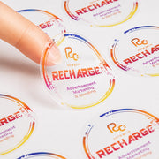 Transparent label sheets applied to clear glass jars and bottles