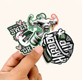 Hand holding custom die cut fitness and automotive stickers