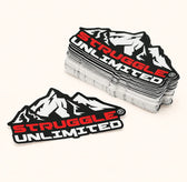 Stacks of custom black red and white brand logo stickers